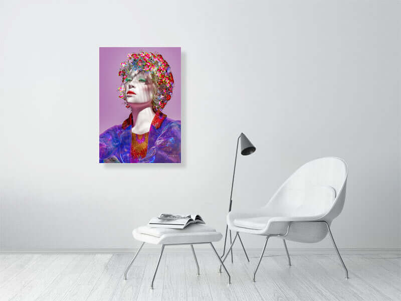 Modern trippy digital art print on a big canvas, displayed in a minimalist room with a white chair and a lamp.