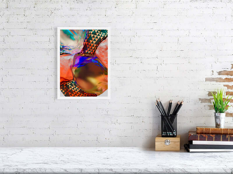 Digital trippy modern art print on Hahnemühle Photorag paper, framed and displayed against a white brick wall with desk accessories.