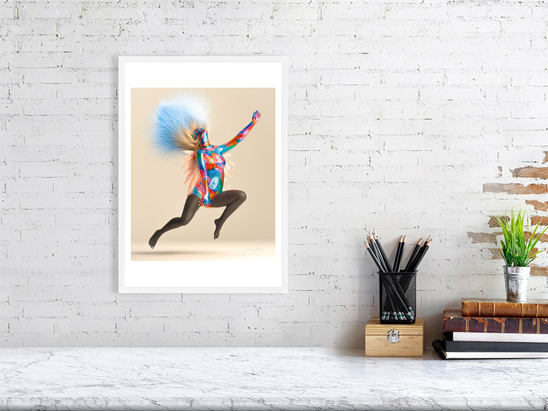 Modern trippy digital art print on framed canvas in minimalist living room with white chair and floor lamp.