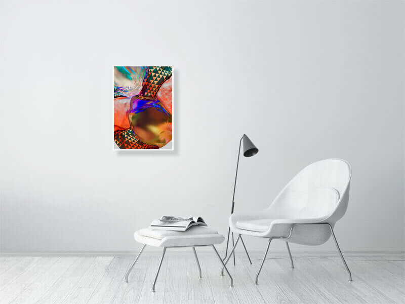 Modern trippy digital art print on framed canvas in a minimalist living room with white chair and floor lamp.