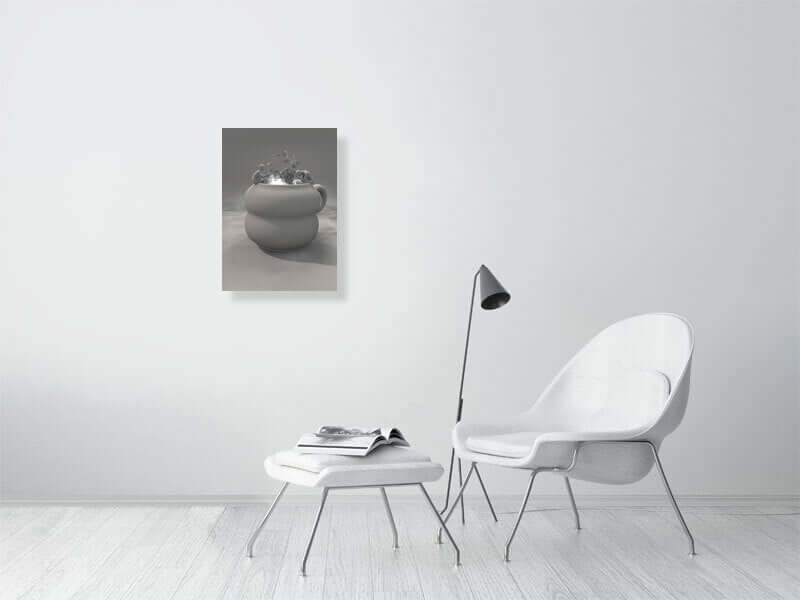 Modern living room with trippy clay cup digital art print on Hahnemühle Photorag paper, framed canvas, and sleek white furniture.