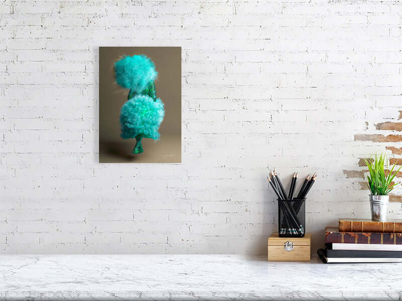 Giclée print artwork called Puff with vibrant, trippy design on Hahnemühle Photorag paper, hung on white brick wall, framed for modern decor.